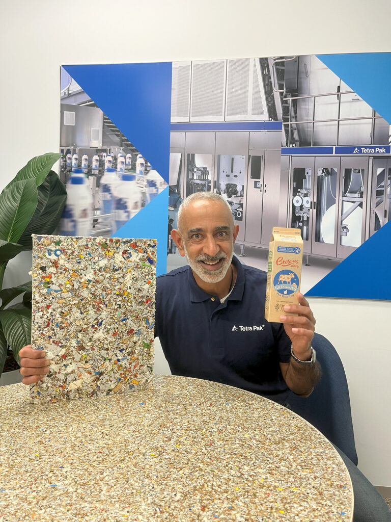 Vikas Ahuja Sustainability Director of Tetra Pak Australia NZ with plaster board made out of recycled Tetra Pak beverage cartons