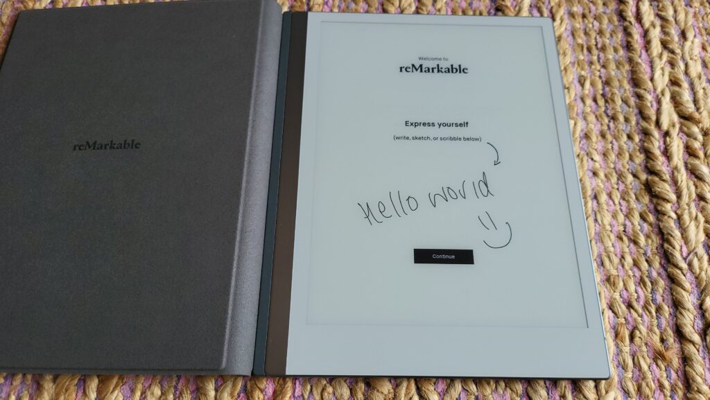 "Hello World =) " written on the front of the reMarkable tablet.