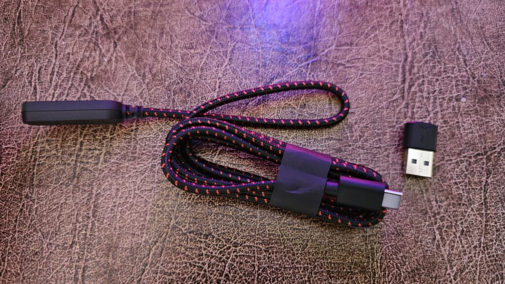 Braided USB cable with an AUX input on one end and a USB-C and USB-A compatible end.