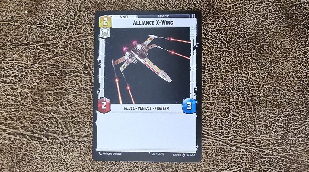 Alliance X Wing card showing cost in yellow (2), attack in red (2), and HP in blue (3). It also says Space Unit at the top.
