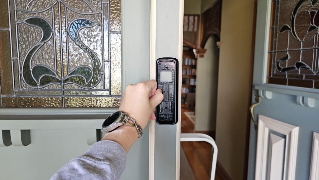 Mounting bracket on the panel next to the door. There's stain glass windows on the door and on the door panel.