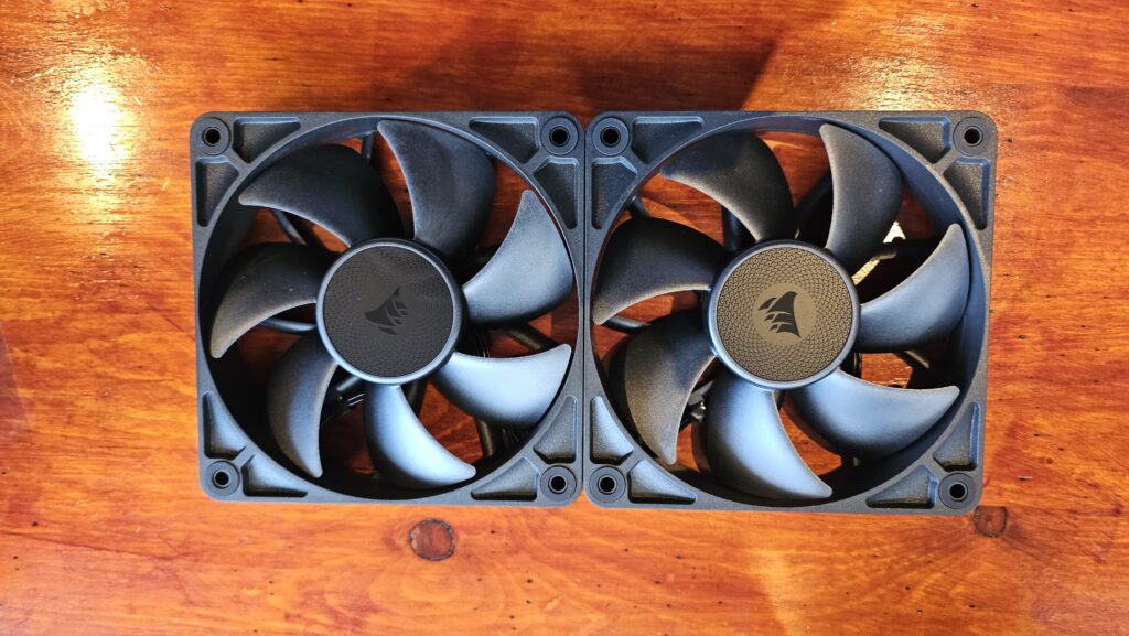 Two fans are snapped together next to one another