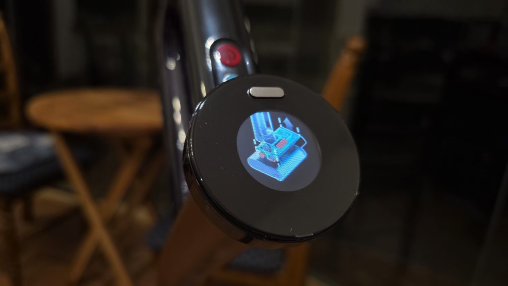 Angle side on image of the high definition LCD screen showing a 3D image of how to safely remove the dirty water caddy.